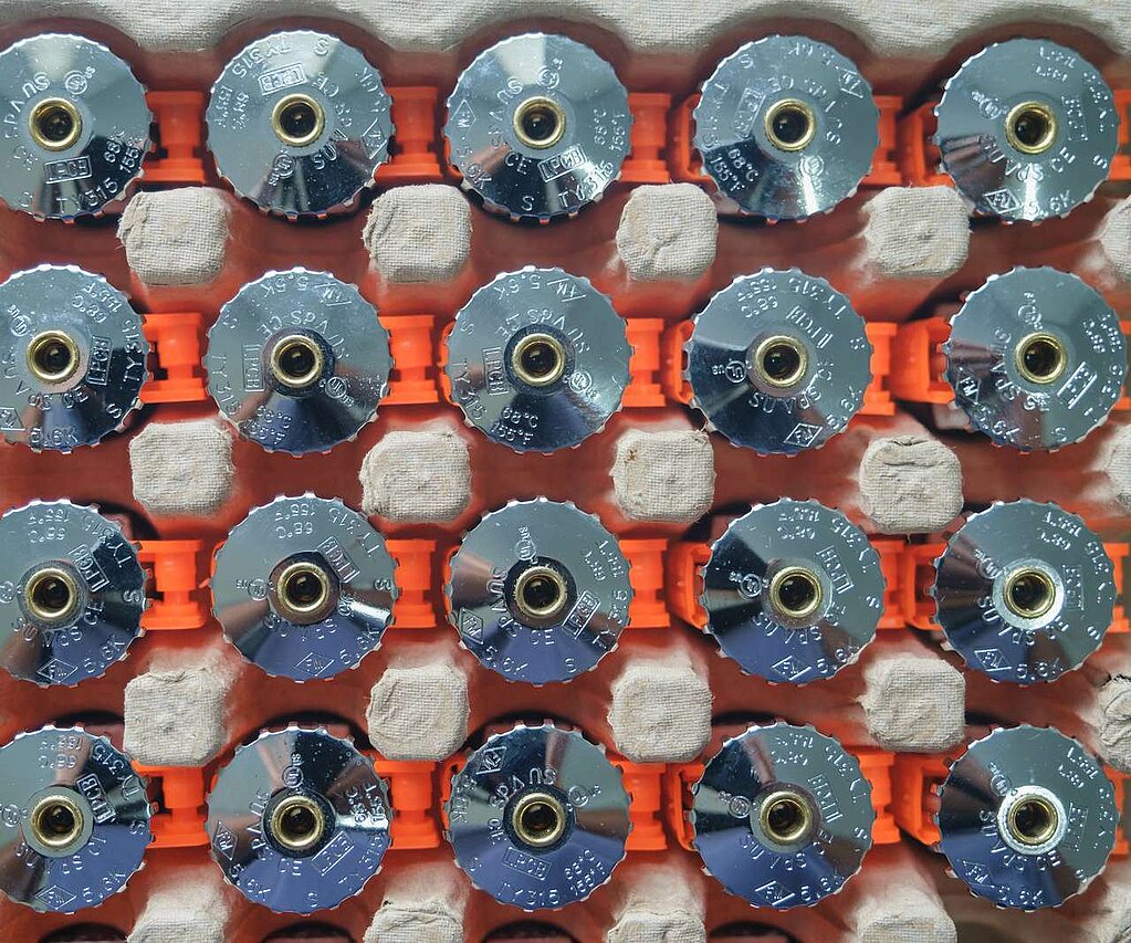 Many silver sprinkler heads